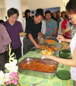 ICIMOD colleagues descending on the refreshments at an all-hands meeting.