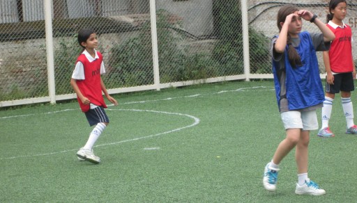 Janani playing defense at the soccer match.  TBS lost 3-2 against KISC.