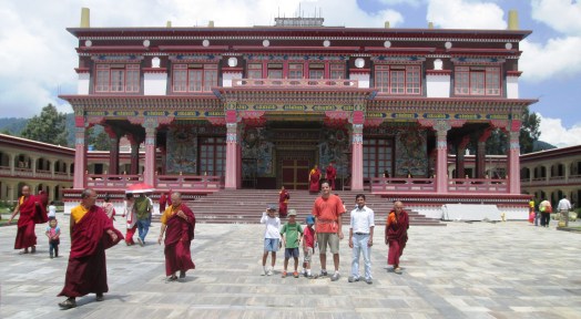 Buddhist nuns and monks shave their heads and wear robes of mustard and maroon.