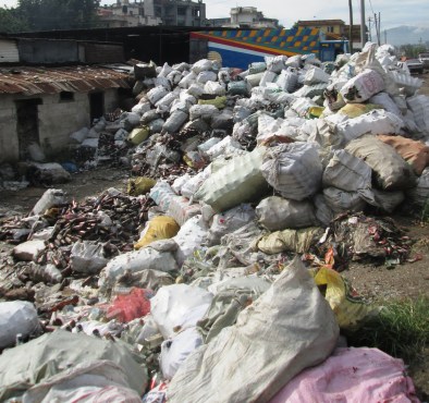 There were several massive recycling centers along the riverside where plastics and glass are collected then trucked to India for processing.  
