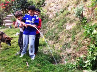 Nishchal, Yulo and me watering the tree we planted!
