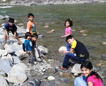 Skipping rocks and collecting a few to take home.